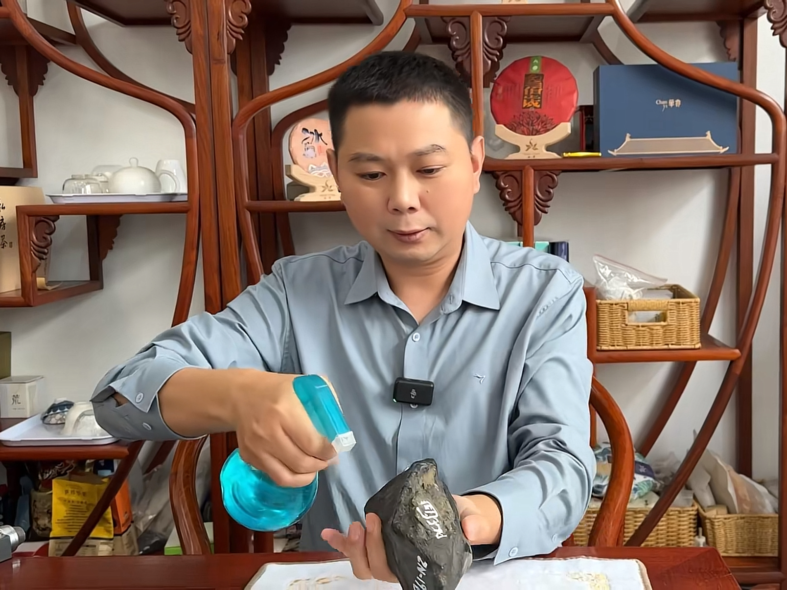Jadeite artisan examining a rough stone
